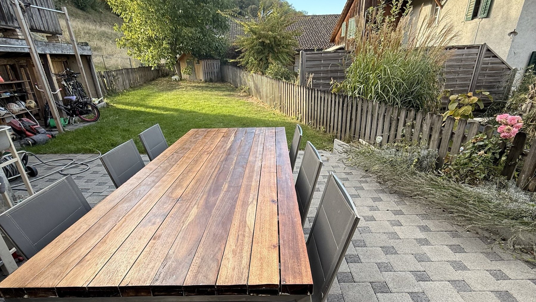 Garden terrace with a large outdoor dining table